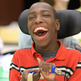 Boy in wheelchair laughing